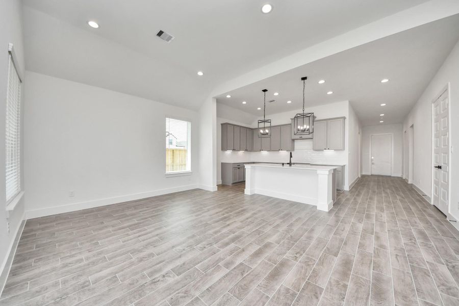 Discover another perspective of this stunning kitchen, generously appointed with an abundance of counter space Discover another perspective of this stunning kitchen, generously appointed with an abundance of counter space