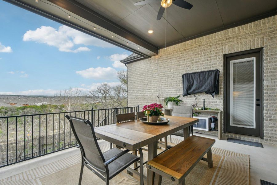 The property features an expansive covered patio with a ceiling fan, recessed lighting, and string lights The property features an expansive covered patio with a ceiling fan, recessed lighting, and string lights