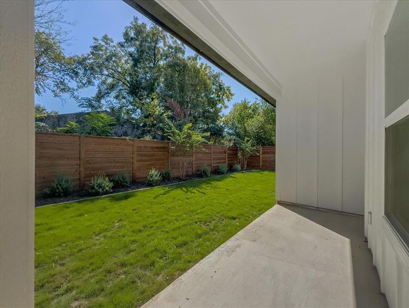 Fenced backyard with a patio Fenced backyard with a patio