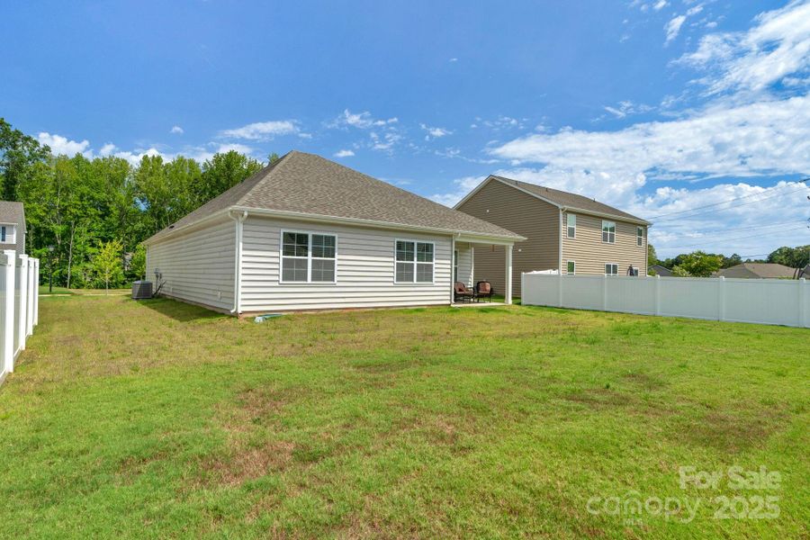 Front exterior of a new home in Crossroads, Locust, NC, highlighting curb appeal (Image 22). Front exterior of a new home in Crossroads, Locust, NC, highlighting curb appeal (Image 22).