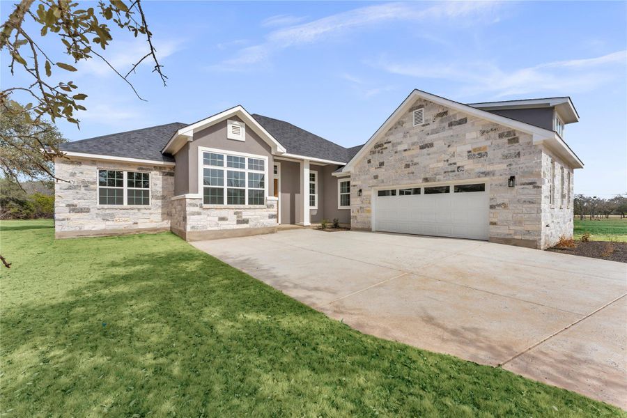 Front exterior of a new home in , Burnet, TX, highlighting curb appeal (Image 2). Front exterior of a new home in , Burnet, TX, highlighting curb appeal (Image 2).