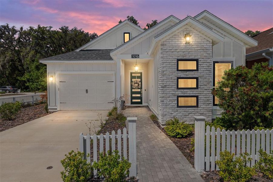 Front exterior of a new home in Fairway Pointe at West End, Newberry, FL, highlighting curb appeal (Image 26).