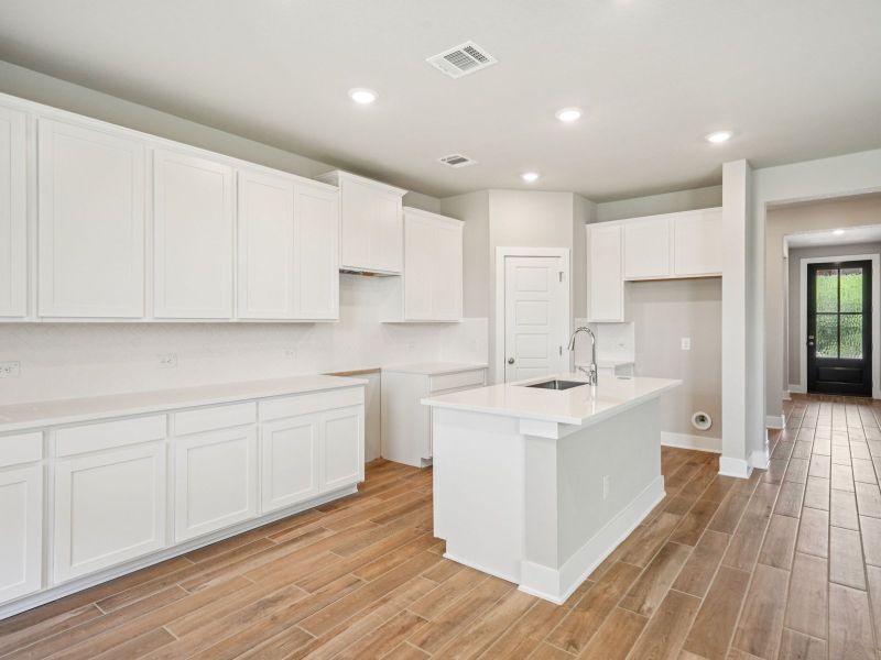 Kitchen in the Red River floorplan at a Meritage Homes community.