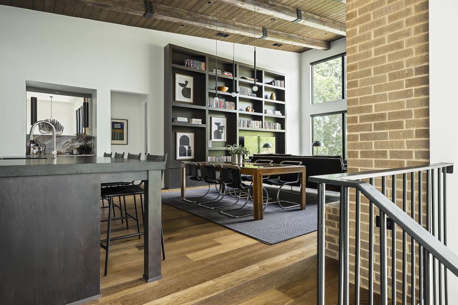 Home office featuring a wood ceiling with exposed beams, dark wood-style floors, and a high ceiling Home office featuring a wood ceiling with exposed beams, dark wood-style floors, and a high ceiling