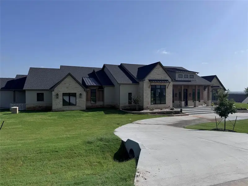 Front exterior of a new home in , Aledo, TX, highlighting curb appeal (Image 2). Front exterior of a new home in , Aledo, TX, highlighting curb appeal (Image 2).
