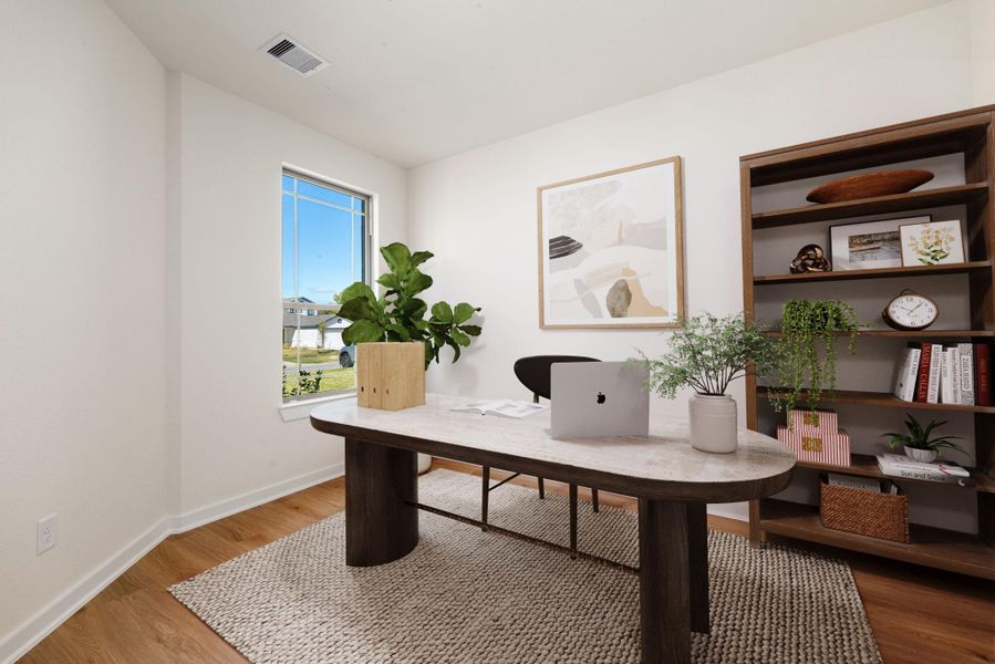 This dedicated home office provides a quiet and productive workspace, featuring wide-plank flooring and abundant natural light streaming in from the large window. The home office comes equipped with double doors that provide privacy for a quiet workspace. *Virtually Staged This dedicated home office provides a quiet and productive workspace, featuring wide-plank flooring and abundant natural light streaming in from the large window. The home office comes equipped with double doors that provide privacy for a quiet workspace. *Virtually Staged