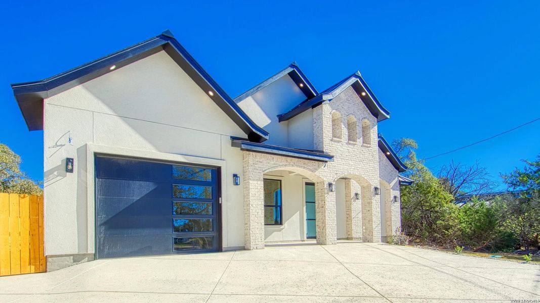 Front exterior of a new home in , Spring Branch, TX, highlighting curb appeal (Image 18).