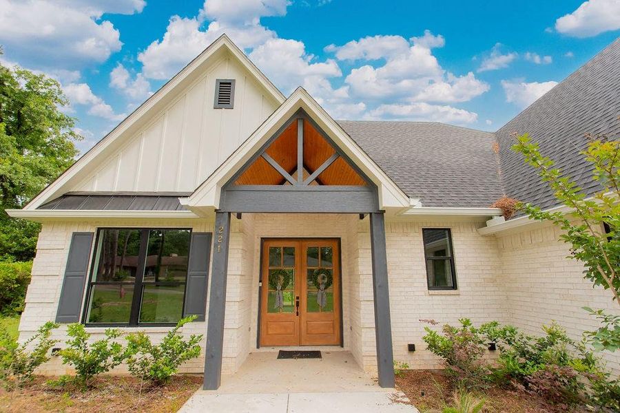 Front exterior of a new home in , Hideaway, TX, highlighting curb appeal (Image 26).