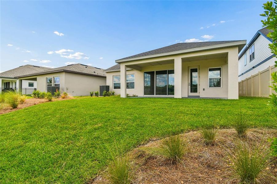 Exterior details and patio area of a home in Oakfield at Mount Dora Village Series, Mount Dora (Image 28).