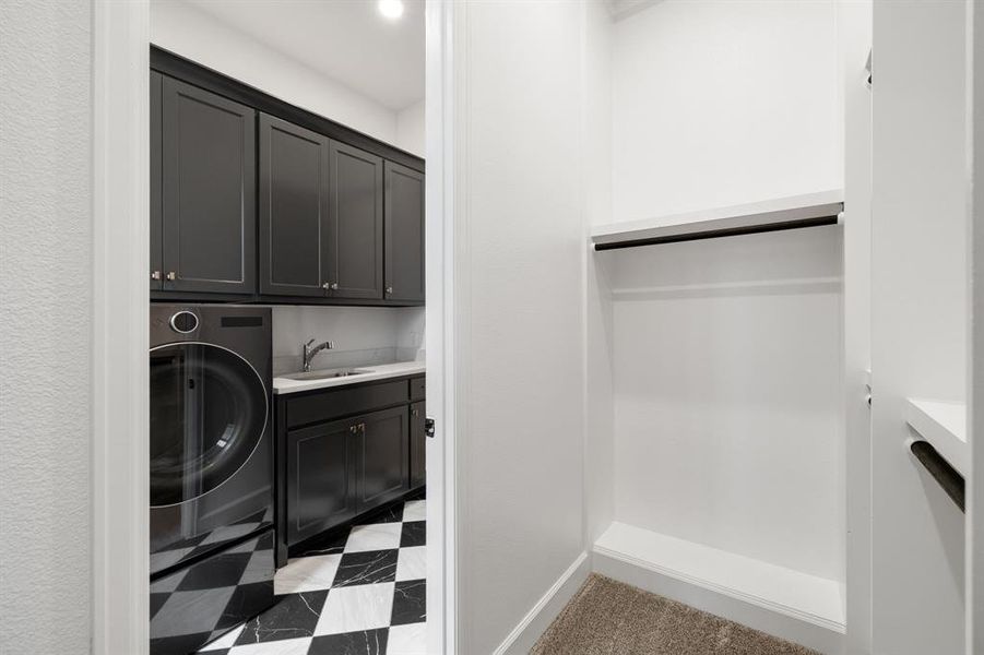 Laundry area with cabinet space and washer / dryer Laundry area with cabinet space and washer / dryer