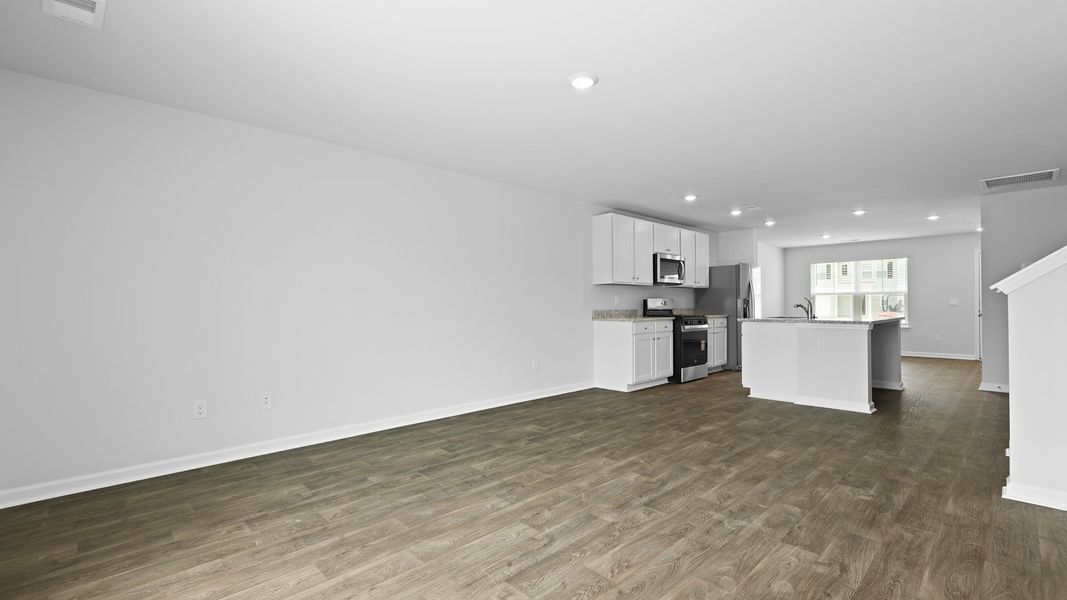 Spacious, unfurnished interior of a new home in Pine Hills Townhomes at Cane Bay, Summerville (Image 19).