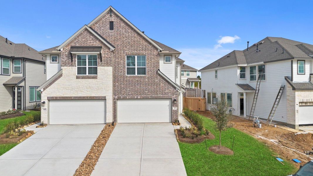 Front exterior of a new home in Woodforest, Montgomery, TX, highlighting curb appeal (Image 2). Front exterior of a new home in Woodforest, Montgomery, TX, highlighting curb appeal (Image 2).