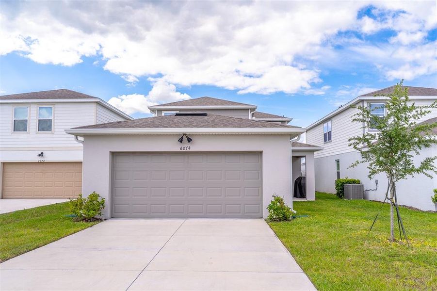 Front exterior of a new home in , St. Cloud, FL, highlighting curb appeal (Image 30).