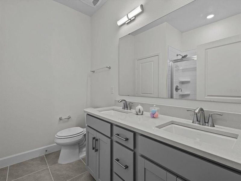 Bathroom 2 - dual sink, quartz counter top , walk in shower