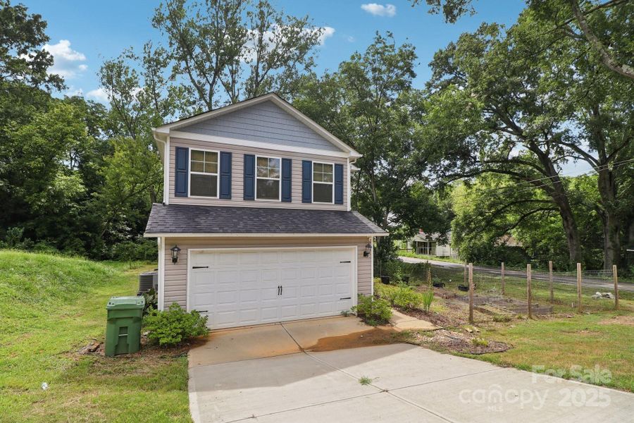 Front exterior of a new home in , Lancaster, SC, highlighting curb appeal (Image 19).