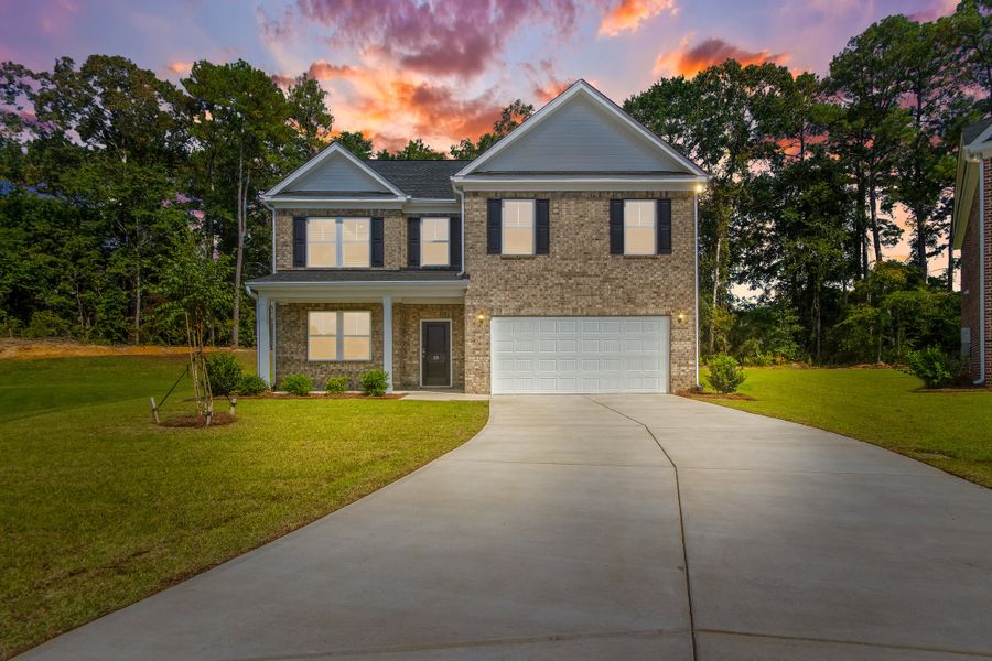 Front exterior of a new home in Heritage Bay, Sumter, SC, highlighting curb appeal (Image 1).
