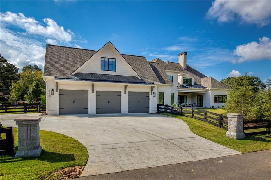 Front exterior of a new home in , Alpharetta, GA, highlighting curb appeal (Image 26). Front exterior of a new home in , Alpharetta, GA, highlighting curb appeal (Image 26).