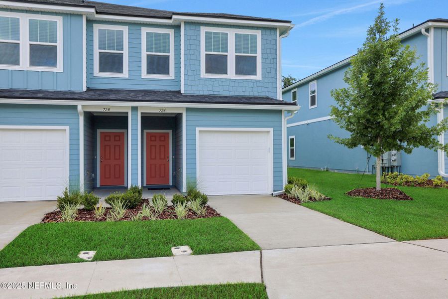 Front exterior of a new home in Kasen Oaks, Jacksonville, FL, highlighting curb appeal (Image 22).