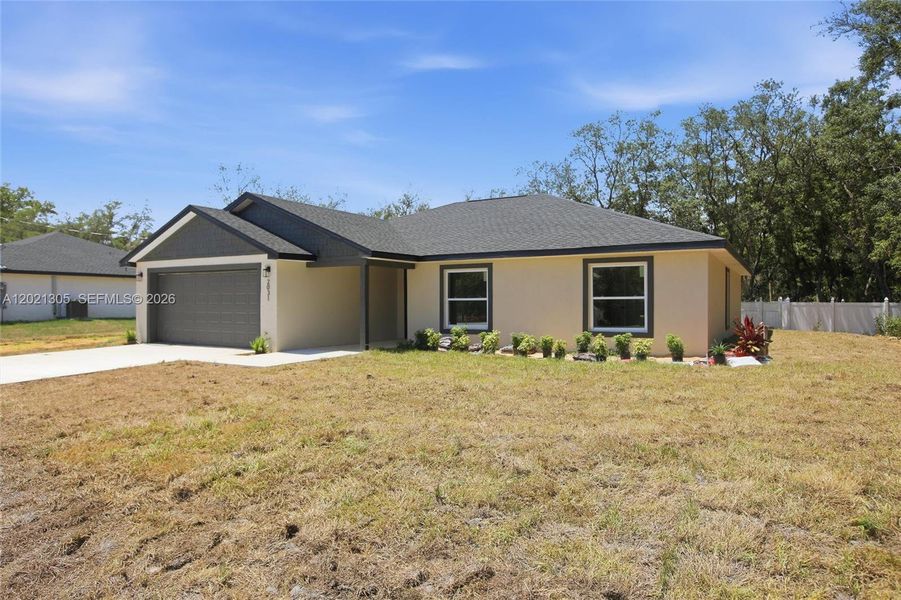 Front exterior of a new home in , Avon Park, FL, highlighting curb appeal (Image 2). Front exterior of a new home in , Avon Park, FL, highlighting curb appeal (Image 2).