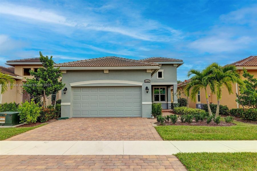 Front exterior of a new home in , Port St. Lucie, FL, highlighting curb appeal (Image 20).