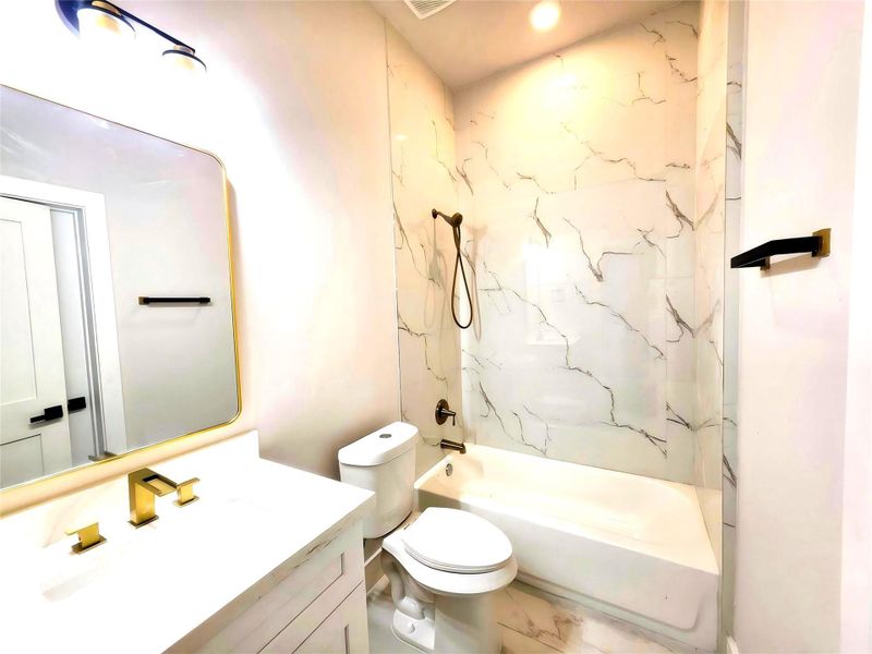 1063-A beautiful Combination of white with gold faucets and black fixtures