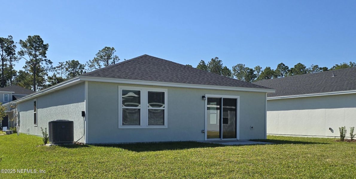 Exterior details and patio area of a home in Flagler Village - Classic Series, Palm Coast (Image 3).