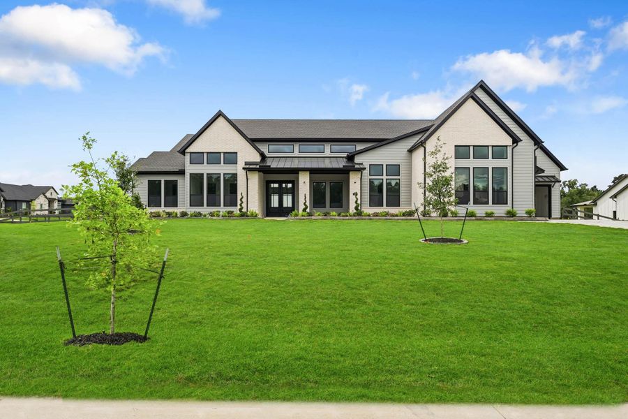 Front exterior of a new home in Bentwood Farms, Montgomery, TX, highlighting curb appeal (Image 1). Front exterior of a new home in Bentwood Farms, Montgomery, TX, highlighting curb appeal (Image 1).