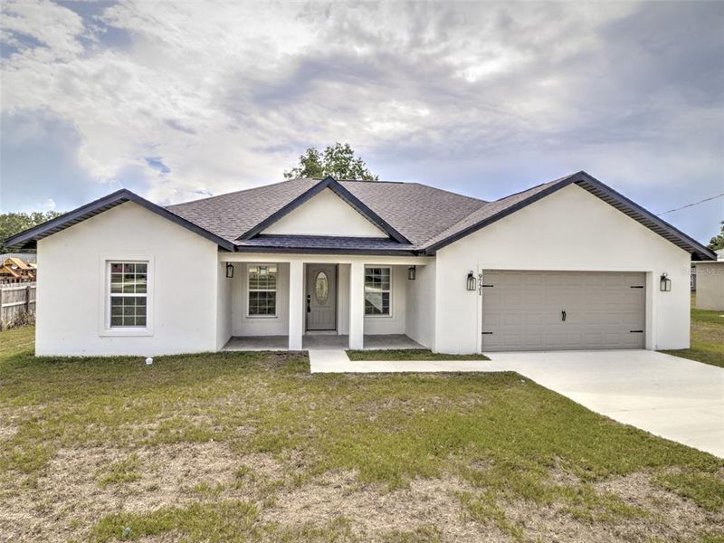 Front exterior of a new home in , Ocala, FL, highlighting curb appeal (Image 2). Front exterior of a new home in , Ocala, FL, highlighting curb appeal (Image 2).