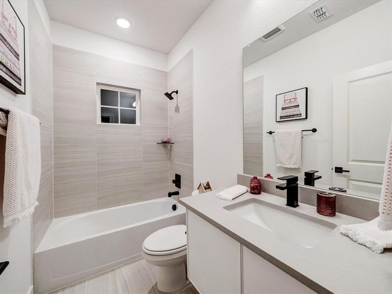 Full bath featuring shower / tub combination and vanity Full bath featuring shower / tub combination and vanity