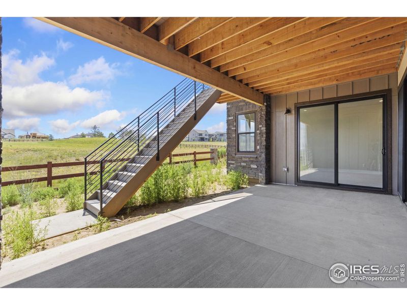 Exterior details and patio area of a home in The Fairways at RainDance, Windsor (Image 13).