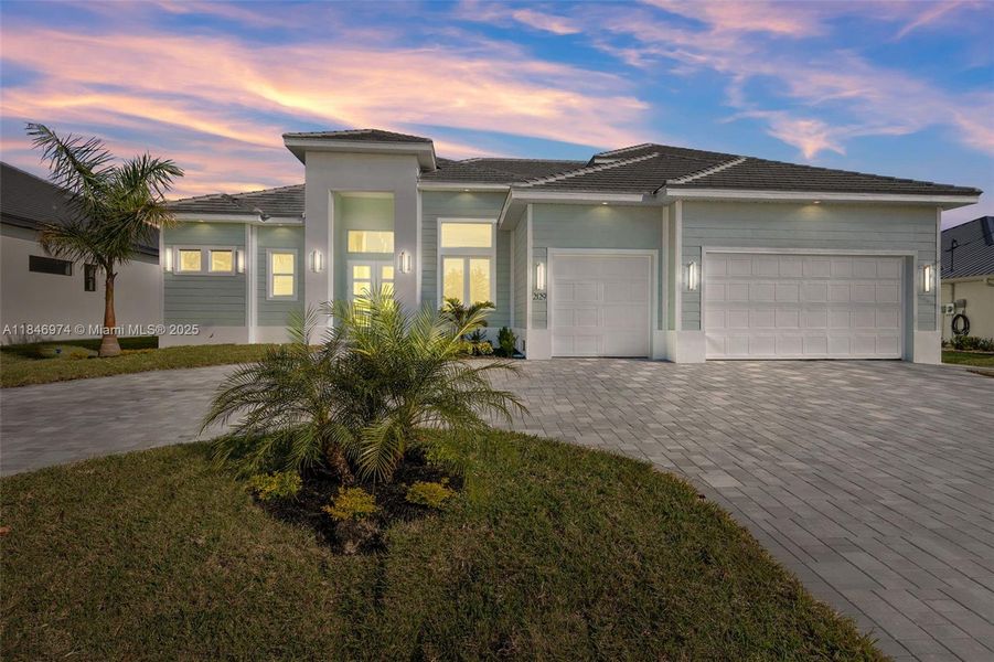Front exterior of a new home in , Cape Coral, FL, highlighting curb appeal (Image 2).