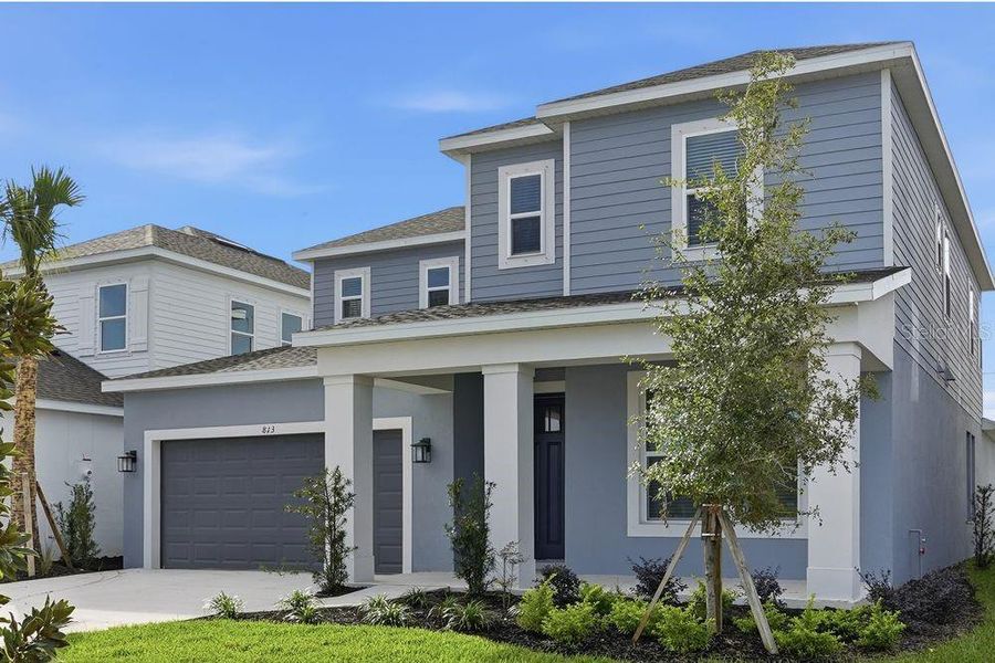 Front exterior of a new home in Indigo Creek, Apollo Beach, FL, highlighting curb appeal (Image 12).
