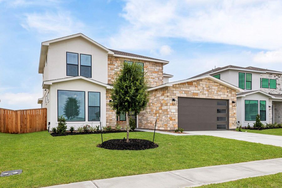 Front exterior of a new home in Hallimore Ranch, Rosenberg, TX, highlighting curb appeal (Image 1).