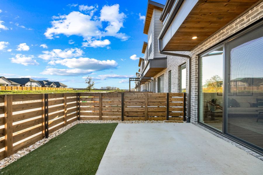 Exterior details and patio area of a home in Willow Grove Townhomes, Melissa (Image 4).