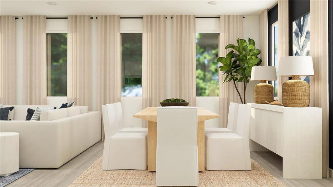 Dining space with healthy amount of natural light and light wood-style flooring Dining space with healthy amount of natural light and light wood-style flooring