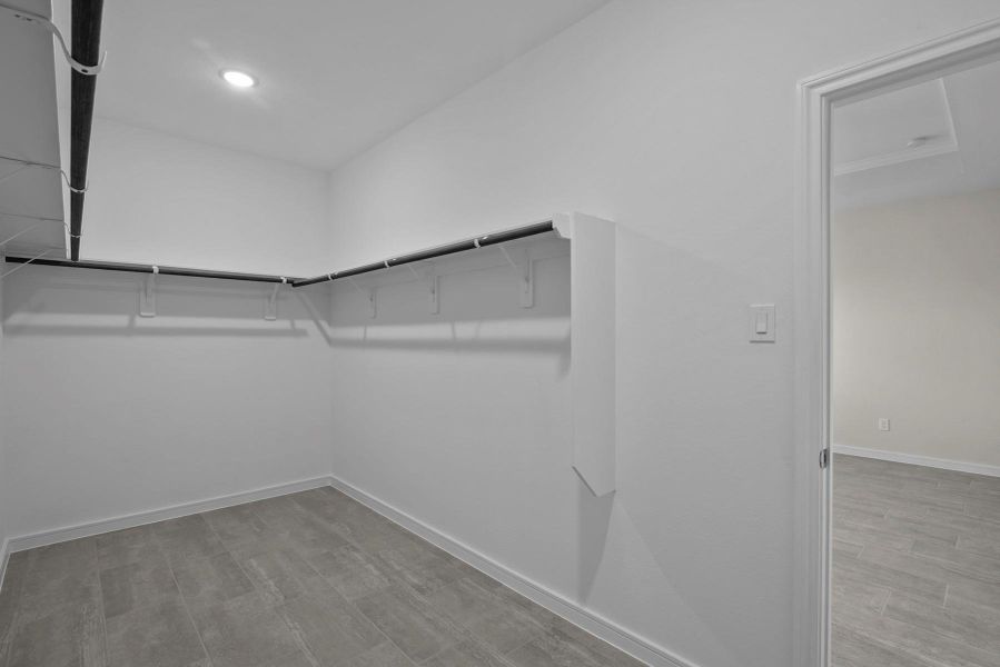 Walk-in closet in the primary suite (*Photo not of actual home and used for illustration purposes only.)