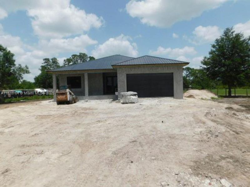 Front exterior of a new home in , Clewiston, FL, highlighting curb appeal (Image 8).