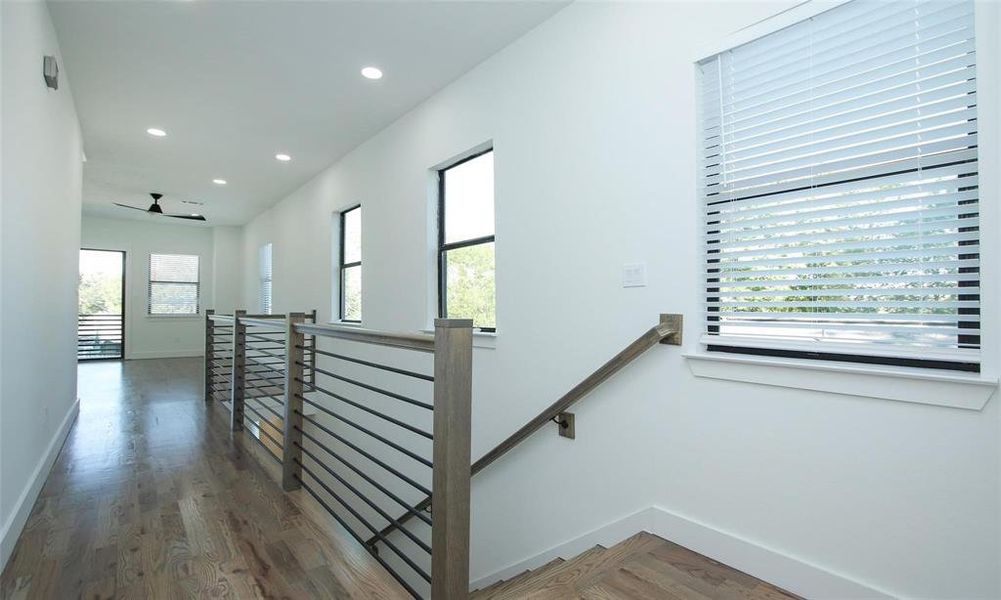 Stair leading to the first floor and hallway leading the flex area.