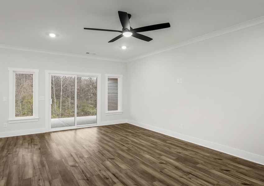 Large living room with a ceiling fan.