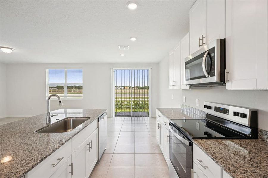 Furnished interior view inside a new home in Villamar - Signature Series, Winter Haven (Image 6).