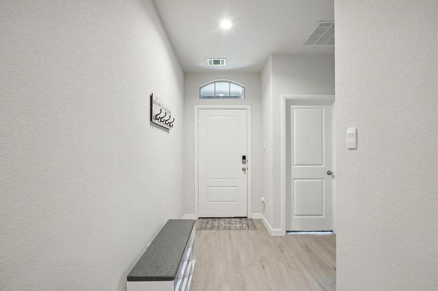 Doorway to outside with light wood-type flooring Doorway to outside with light wood-type flooring