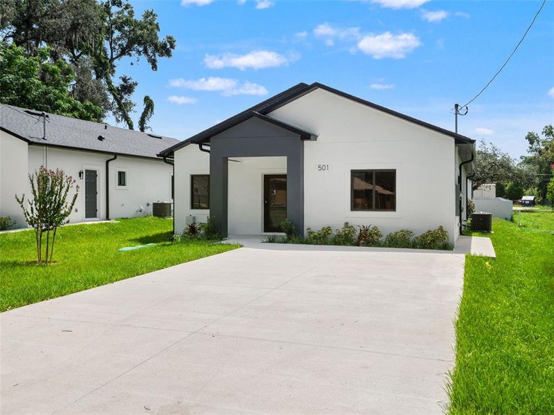 Front exterior of a new home in , Apopka, FL, highlighting curb appeal (Image 2). Front exterior of a new home in , Apopka, FL, highlighting curb appeal (Image 2).