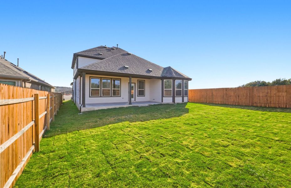 Exterior details and patio area of a home in Saddleback at Santa Rita Ranch, Liberty Hill (Image 26).