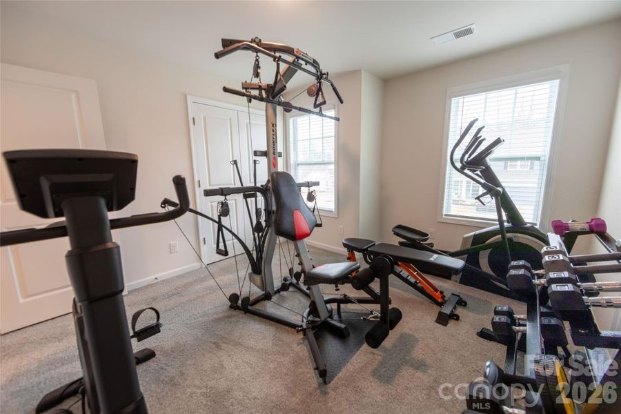 Fifth bedroom currently utilized as a home gym.