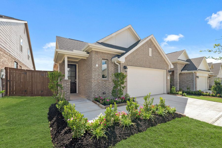 Front exterior of a new home in The Trails, New Caney, TX, highlighting curb appeal (Image 21). Front exterior of a new home in The Trails, New Caney, TX, highlighting curb appeal (Image 21).
