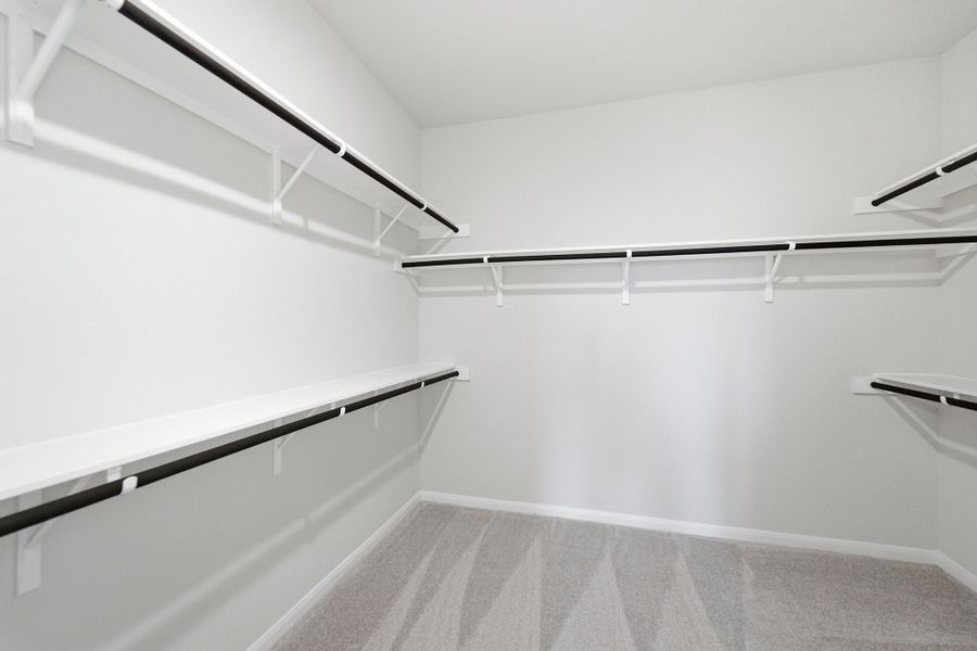 Spacious, unfurnished interior of a new home in The Woodlands at Medina Hills, Mico (Image 32).