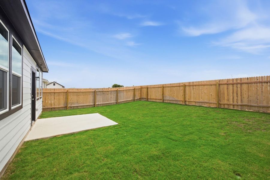 Exterior details and patio area of a home in Stallion Run, Buda (Image 28).