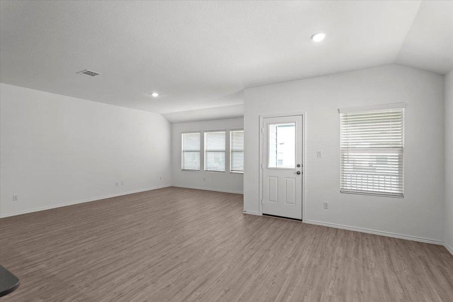 Plenty of natural light fills this inviting room with durable flooring and modern recessed lighting. Plenty of natural light fills this inviting room with durable flooring and modern recessed lighting.
