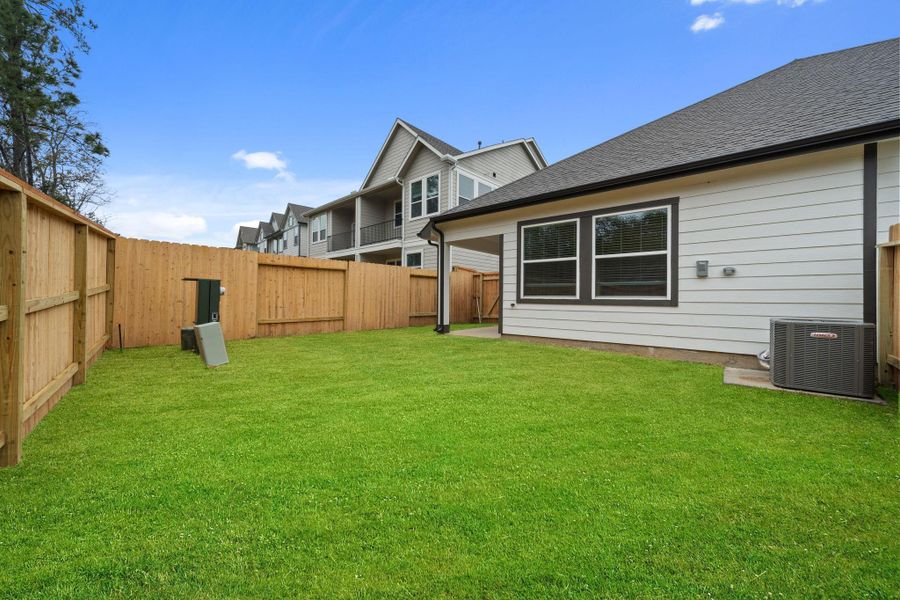 Exterior details and patio area of a home in Woodforest, Montgomery (Image 21).
