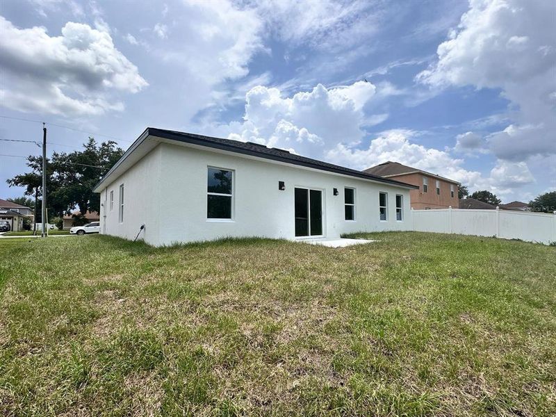 Front exterior of a new home in , Poinciana, FL, highlighting curb appeal (Image 25). Front exterior of a new home in , Poinciana, FL, highlighting curb appeal (Image 25).